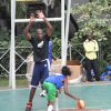 Dikembe Mutombo blocks a shot at the DMF Basketball clinic in Kinshasa